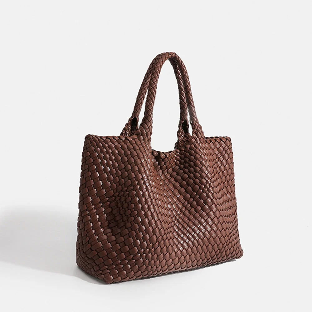 Woven tote bag in brown with chunky basket weave texture and structured rectangular silhouette