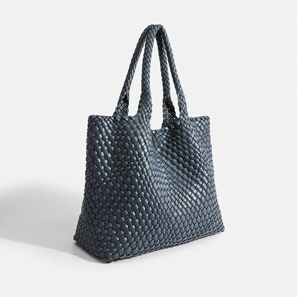 Olive green woven tote bag with basket weave texture across entire surface