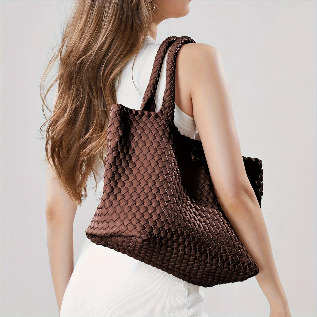 Off-white woven tote bag with chunky basket weave and polished finish