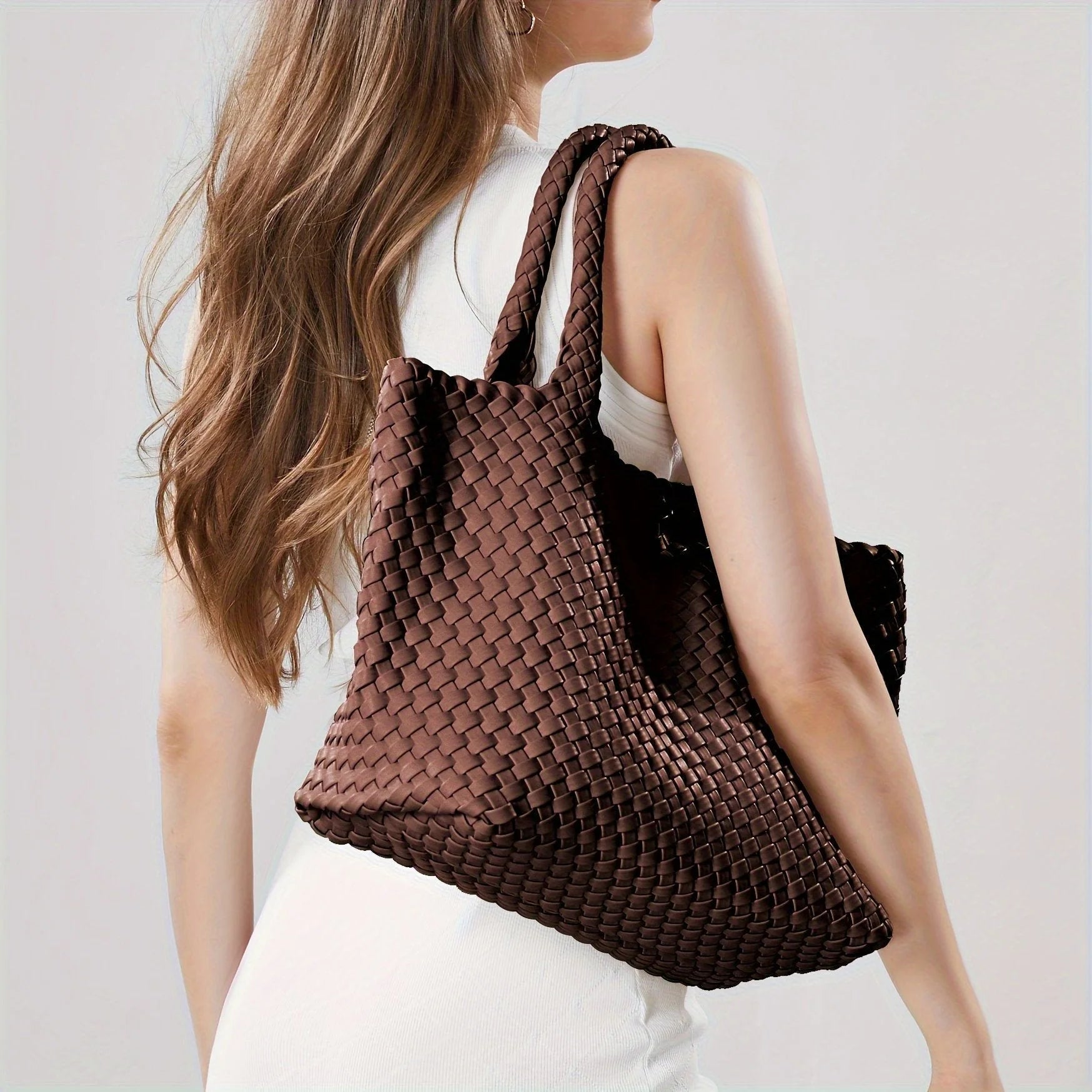 Off-white woven tote bag with chunky basket weave and polished finish