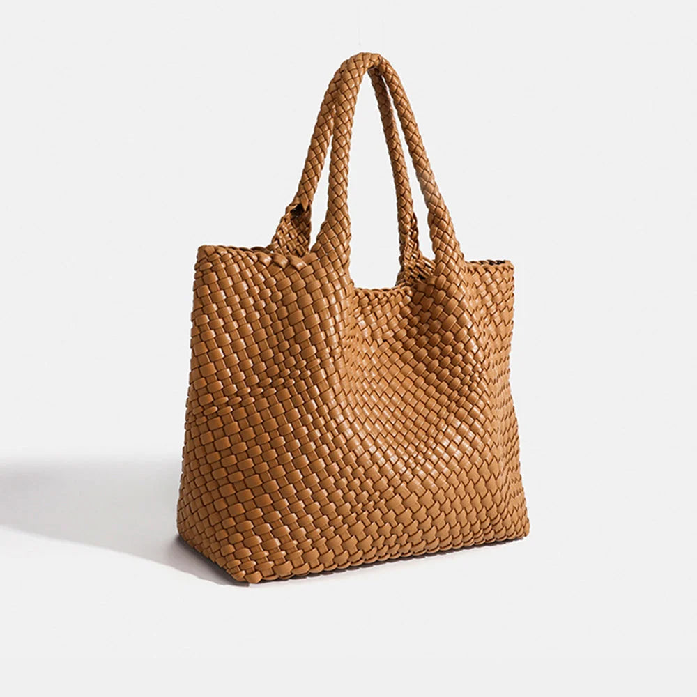 Side view of woven tote bag showing basket weave pattern across body and woven handles