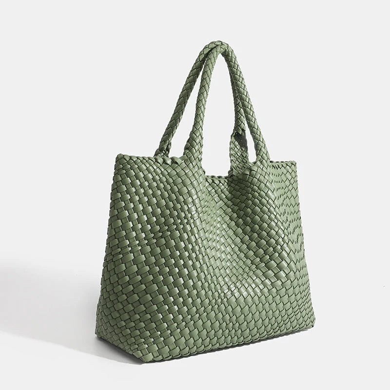 Woven tote bag in blue showing interlaced panel construction and relaxed silhouette