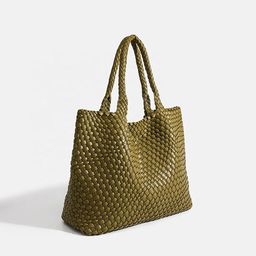 Black woven tote bag with artisan basket weave texture and smooth finish
