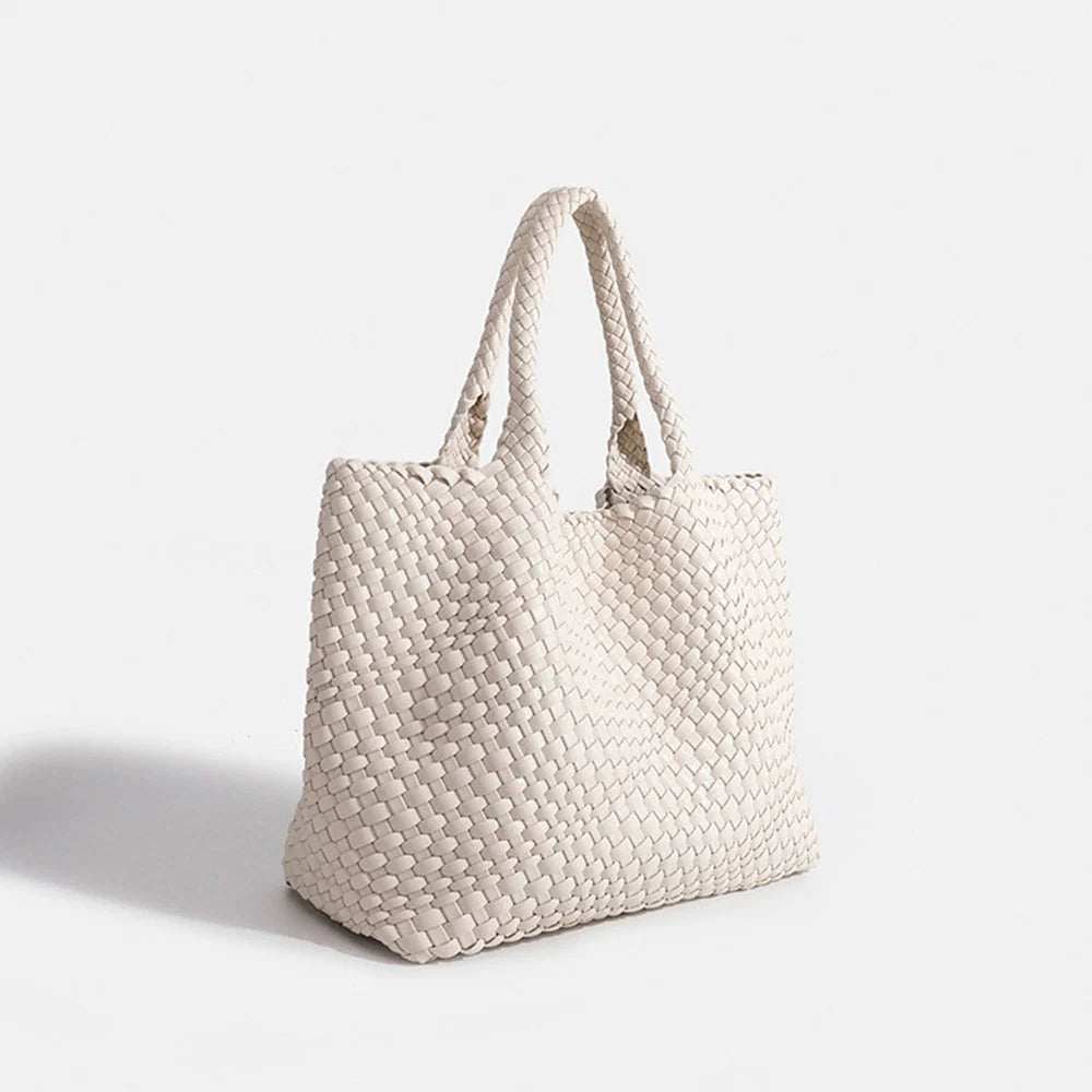 Dark green woven tote bag with chunky weave pattern and spacious open compartment