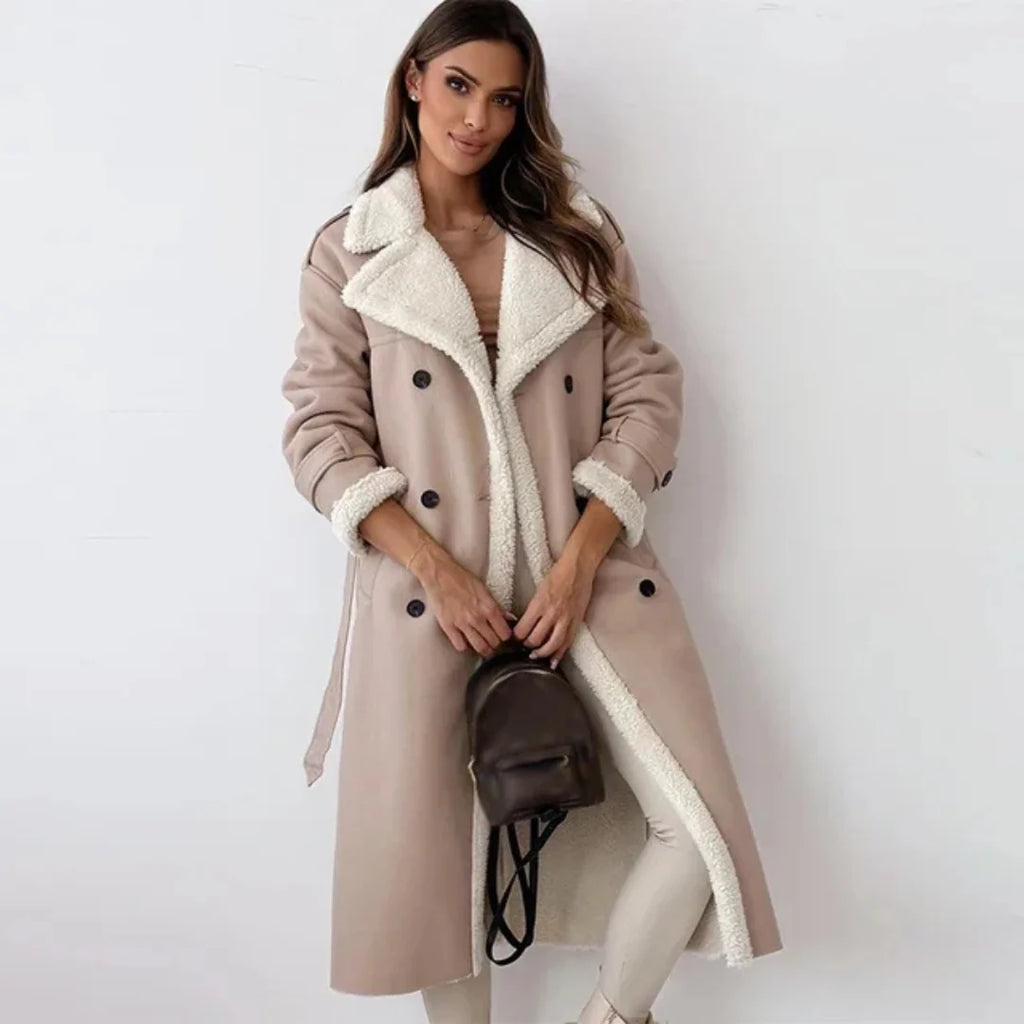 Side view of women's belted trench coat showing structured silhouette and midi-length hem