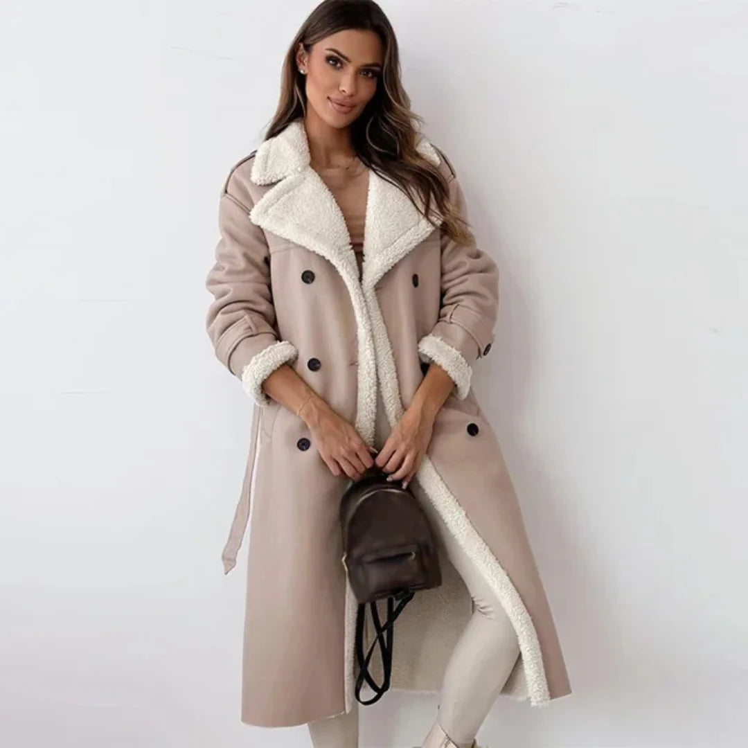 Side view of women's belted trench coat showing structured silhouette and midi-length hem
