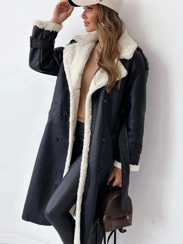 Women's trench coat styled with neutral trousers and handbag for autumn wear