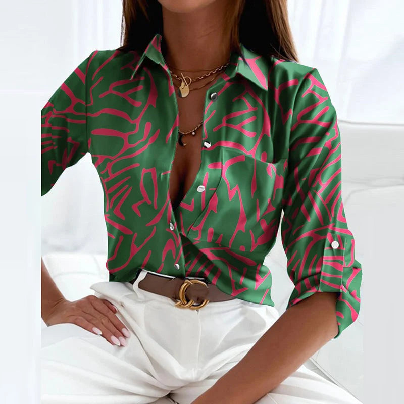 Full view of printed blouse displaying classic collar and three-quarter sleeves