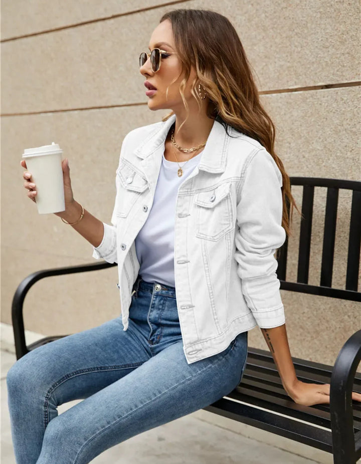 Back view of cropped denim jacket displaying structured fit and smooth finish