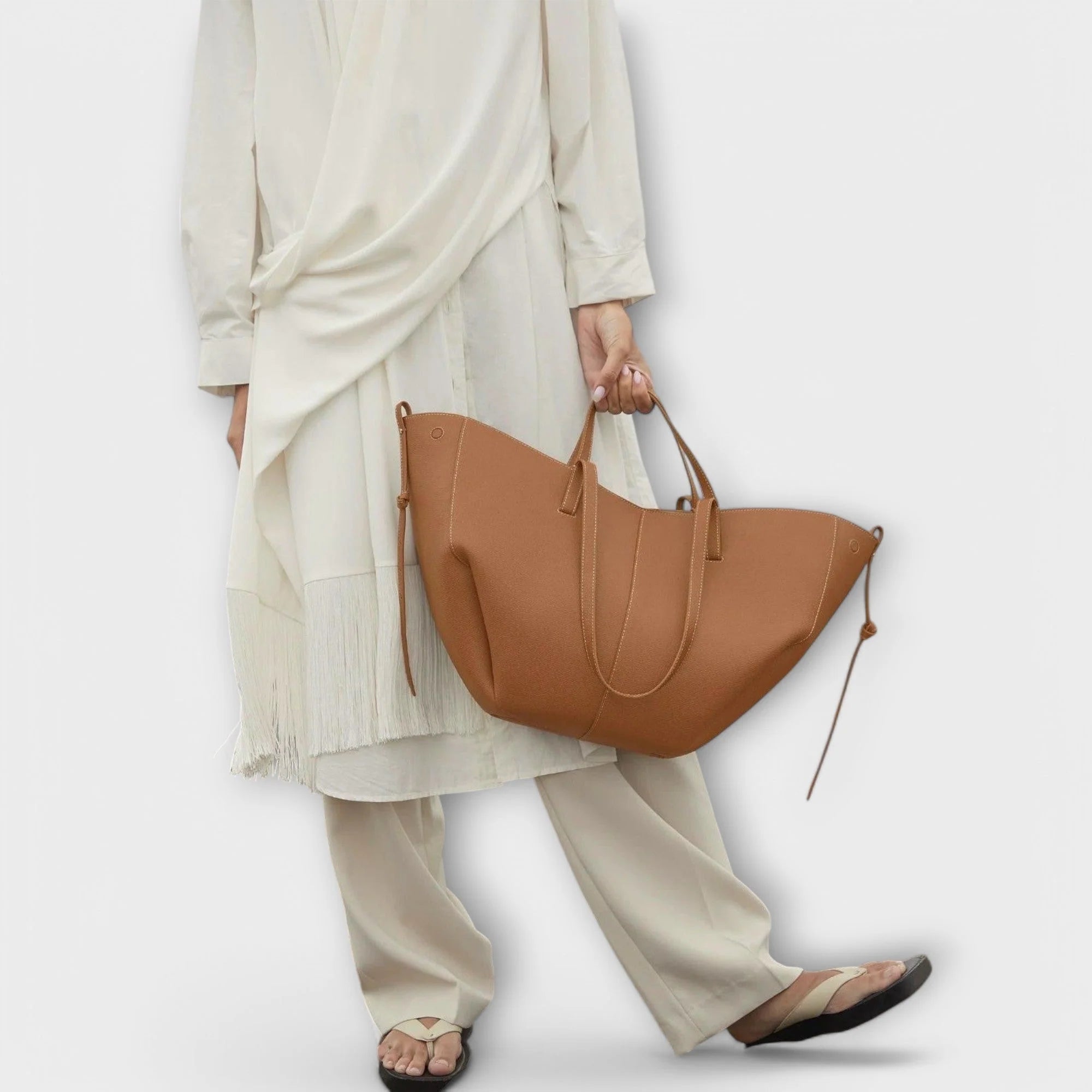 Structured tote bag three-quarter view displaying roomy interior and dual carry handles