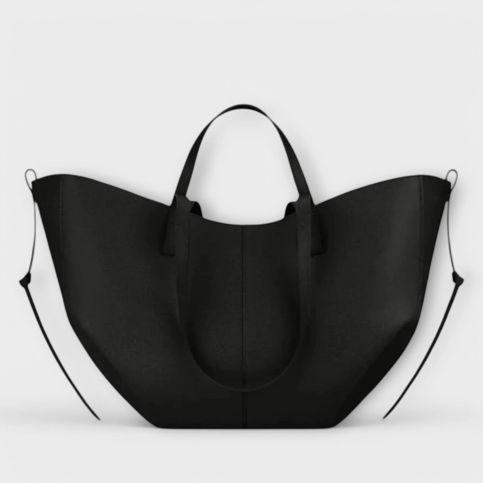 Women's structured tote bag side view displaying crescent silhouette and adjustable shoulder strap