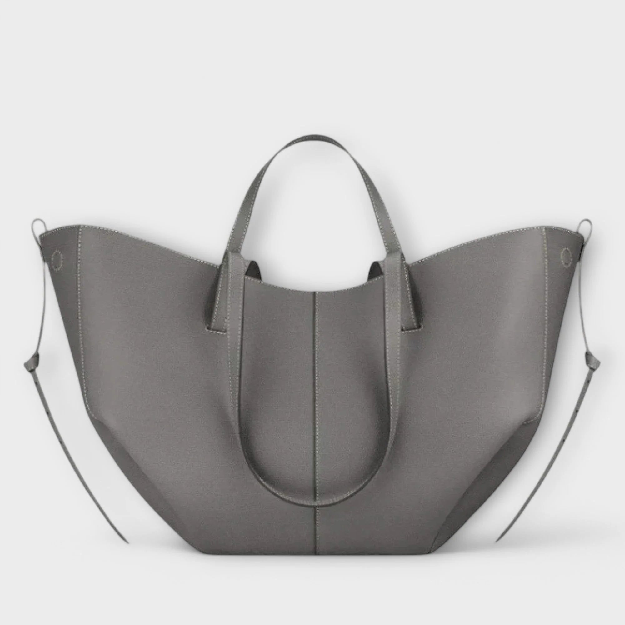 Curved tote bag interior view showing spacious compartment and magnetic closure mechanism