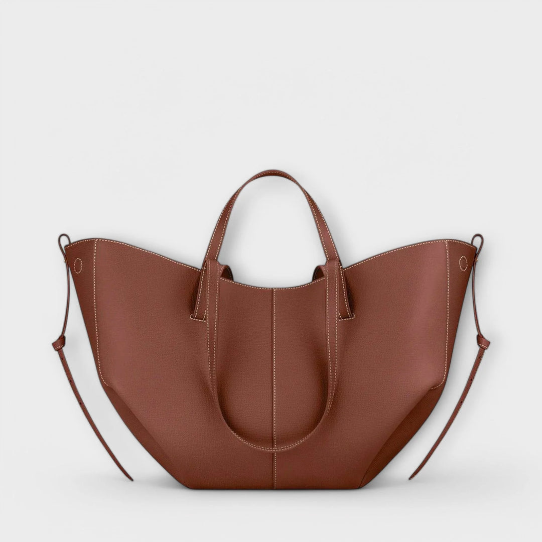 Taupe tote bag worn on shoulder demonstrating versatile carrying options for everyday use