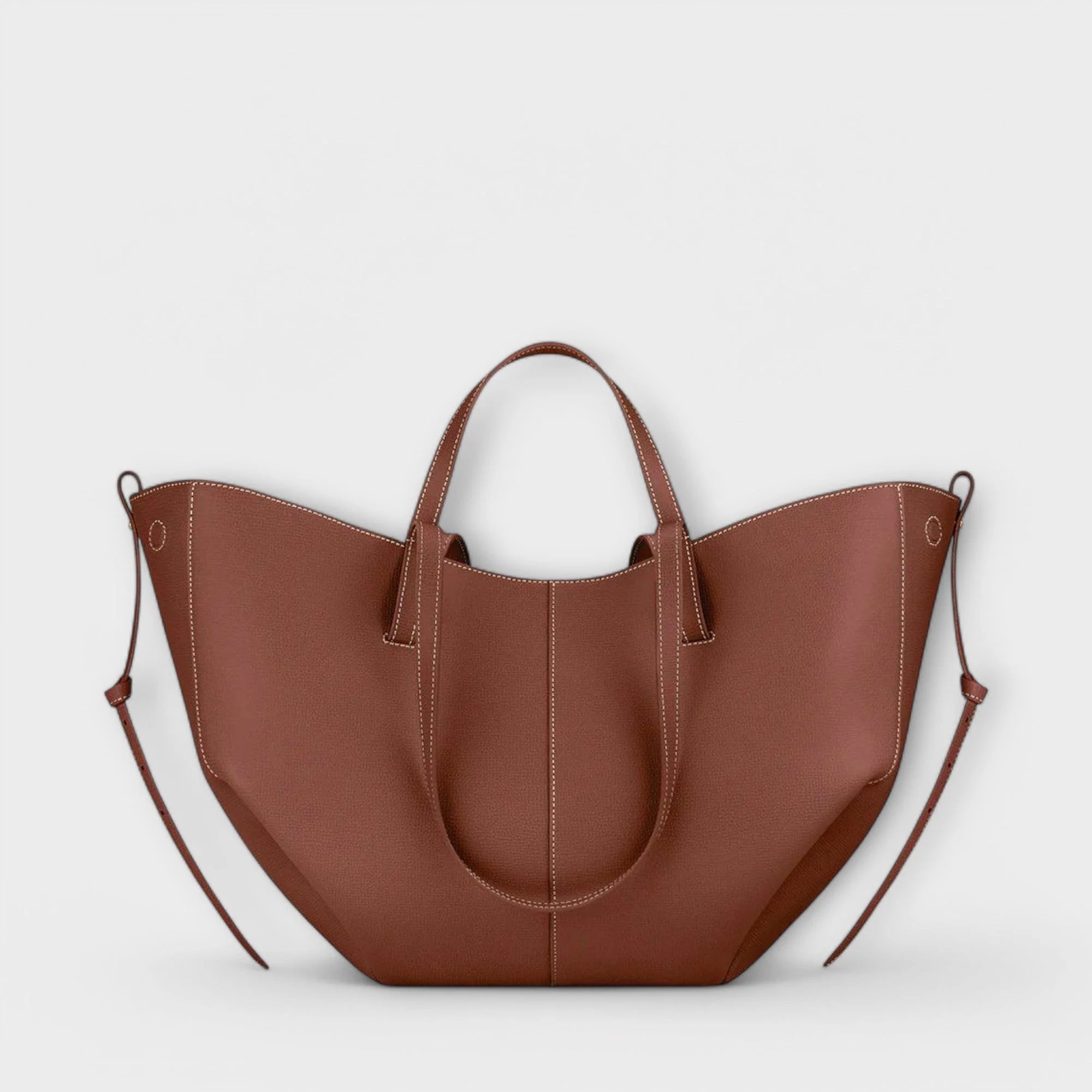 Taupe tote bag worn on shoulder demonstrating versatile carrying options for everyday use