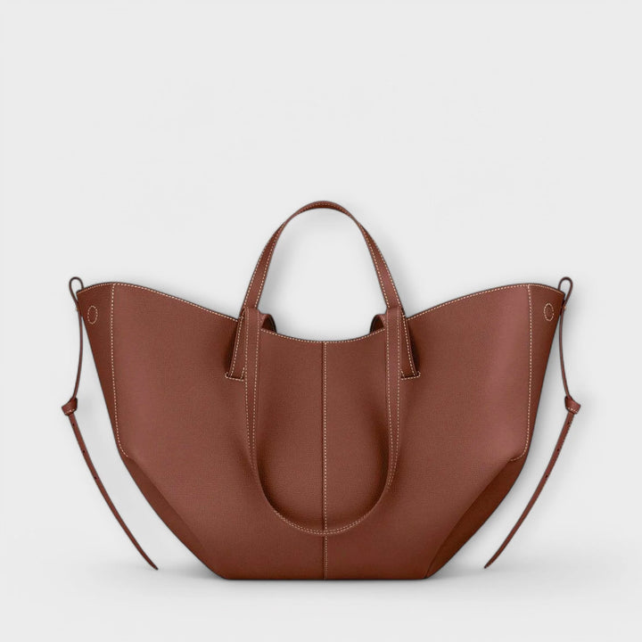 Taupe tote bag worn on shoulder demonstrating versatile carrying options for everyday use