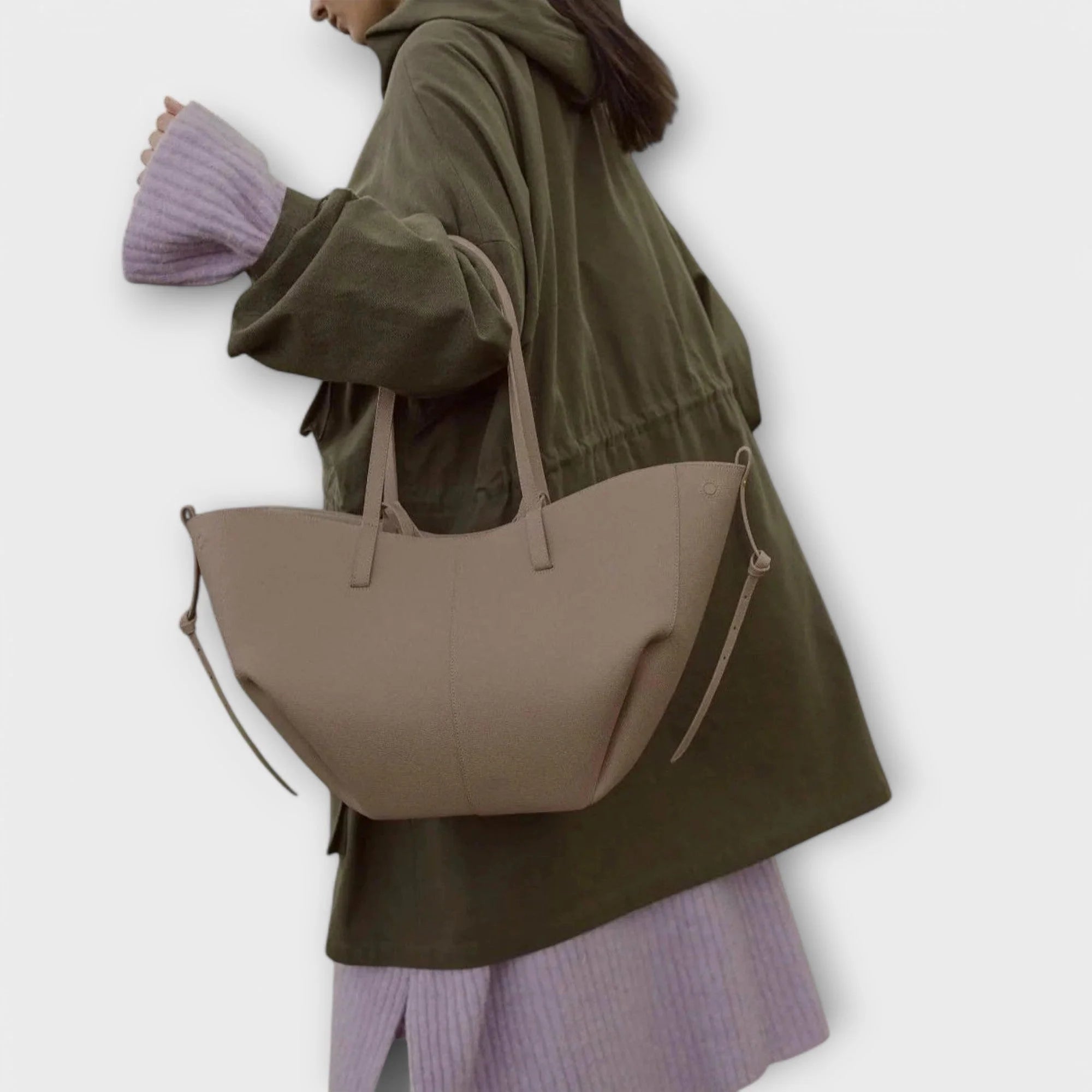 Curved tote bag back view highlighting smooth finish exterior and structured shape