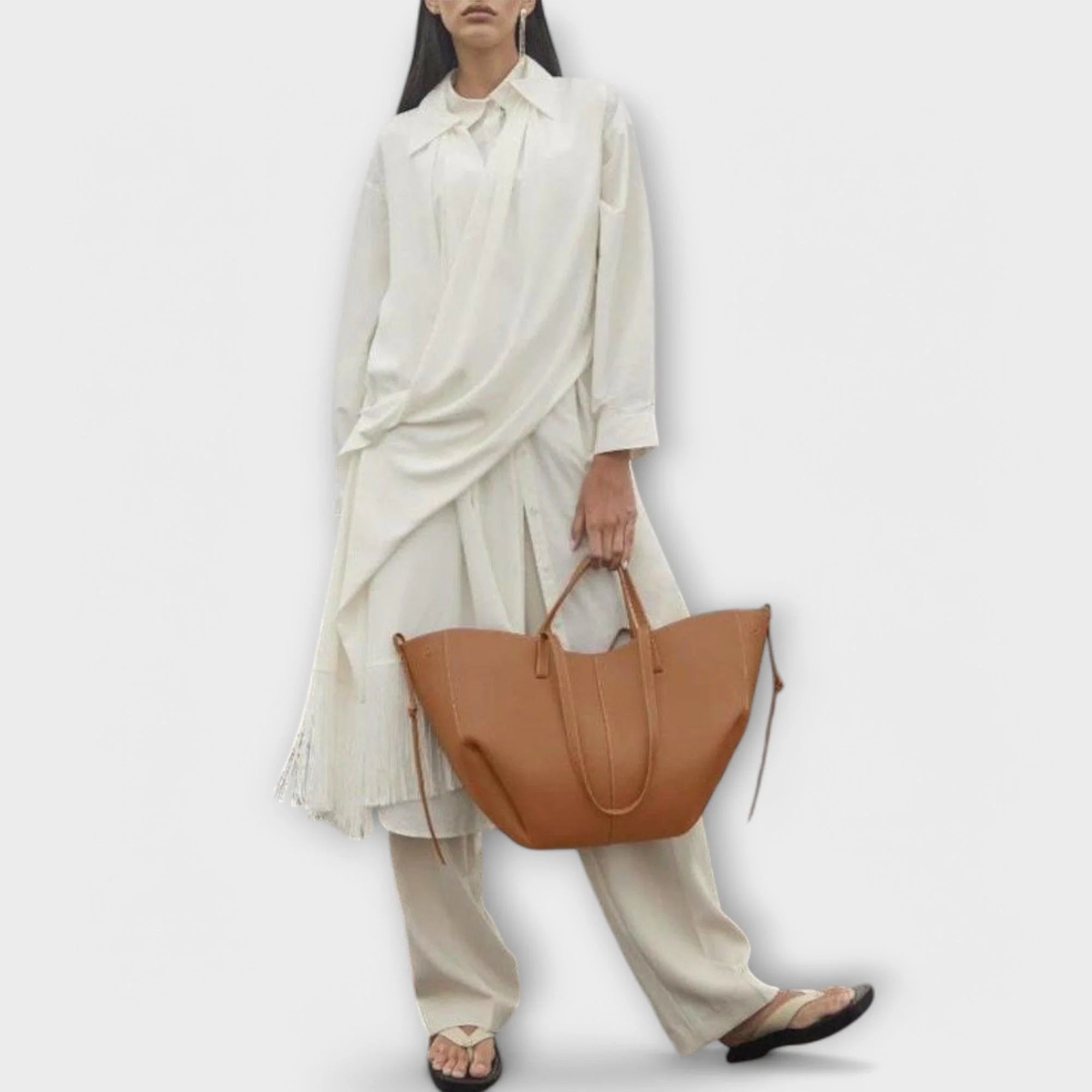 Women's crescent tote bag close-up showing clean stitching and refined hardware details