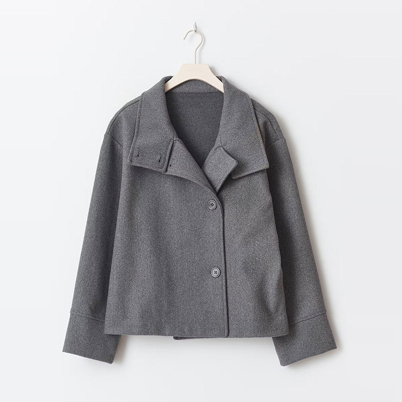 Side view of relaxed women's wool coat displaying hip-length cut and comfortable drape