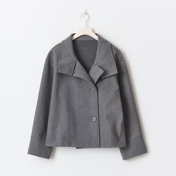 Side view of relaxed women's wool coat displaying hip-length cut and comfortable drape