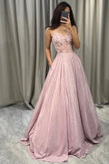 Embellished maxi dress with lace bodice and flowing shimmer skirt in soft pink, full-length view