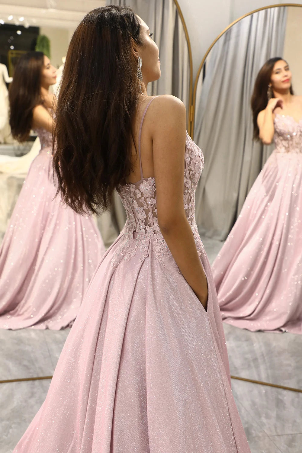 Close-up of embellished maxi dress bodice showing floral lace appliqués and sweetheart neckline detail