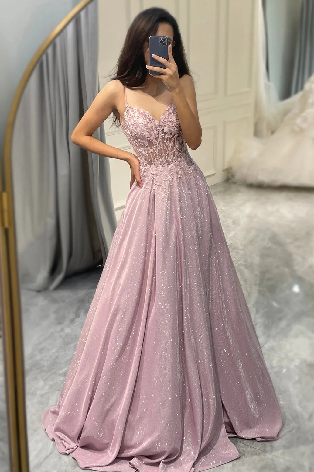 Side view of embellished maxi dress highlighting A-line silhouette and floor-length flowing skirt