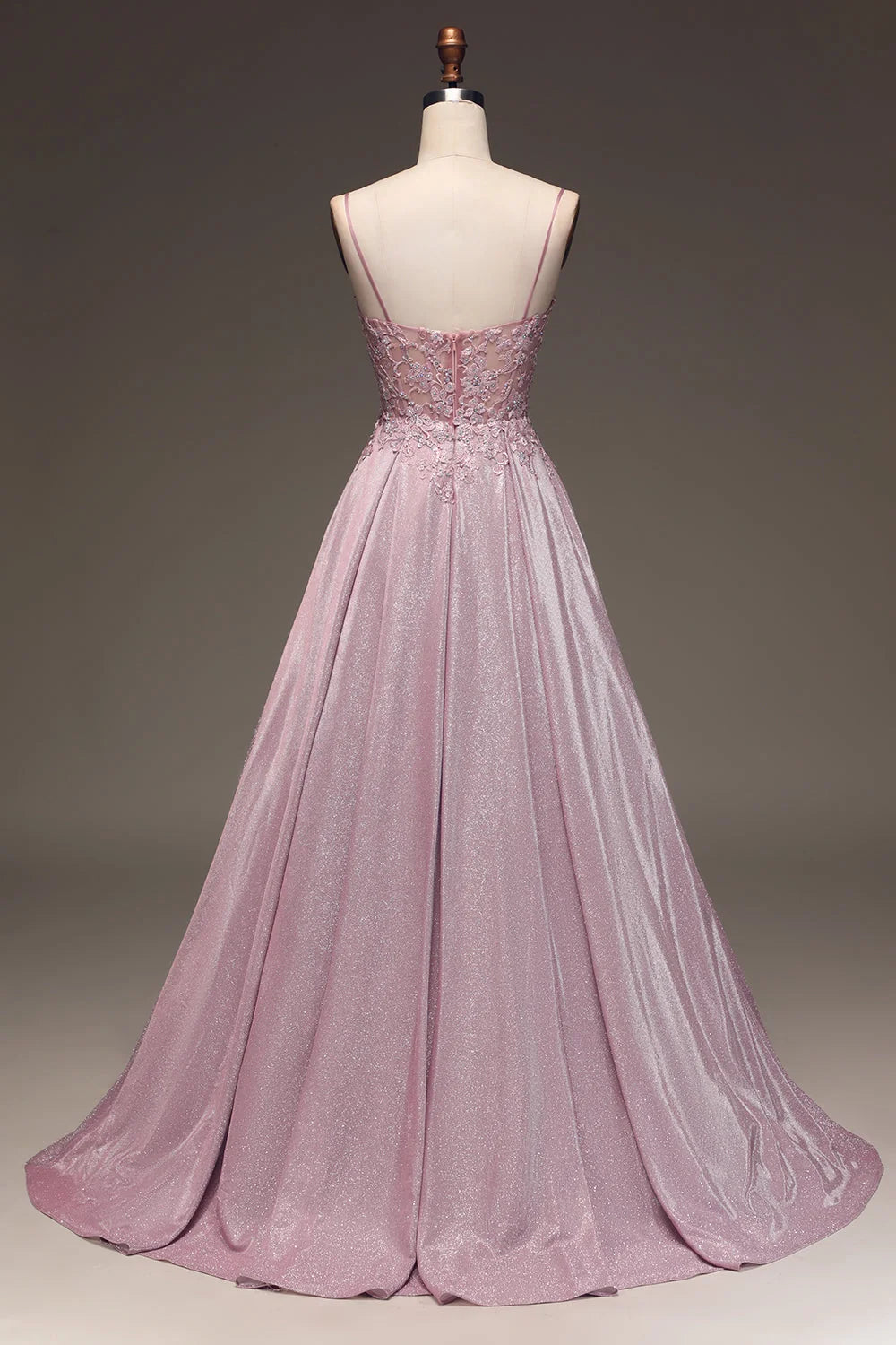 Full-length embellished maxi dress on model showing fitted waist and graceful skirt movement
