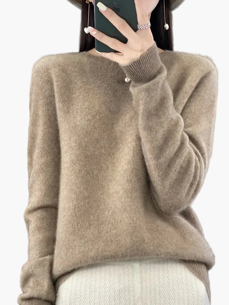 Women's crew neck jumper in beige with ribbed detailing and long sleeves shown on model