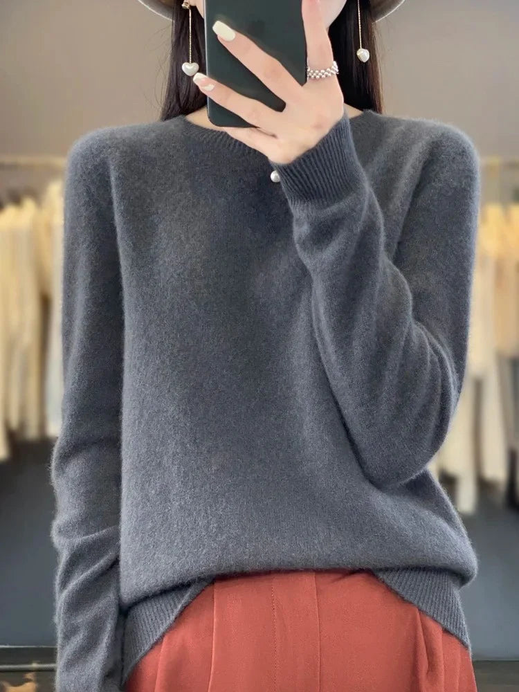 Sleeve detail of women's knit jumper with ribbed cuffs