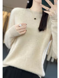 Women's knit jumper styled casually with white trousers for autumn