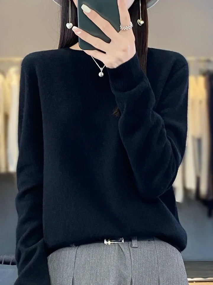 Close-up of ribbed hem detailing on women's hip-length jumper
