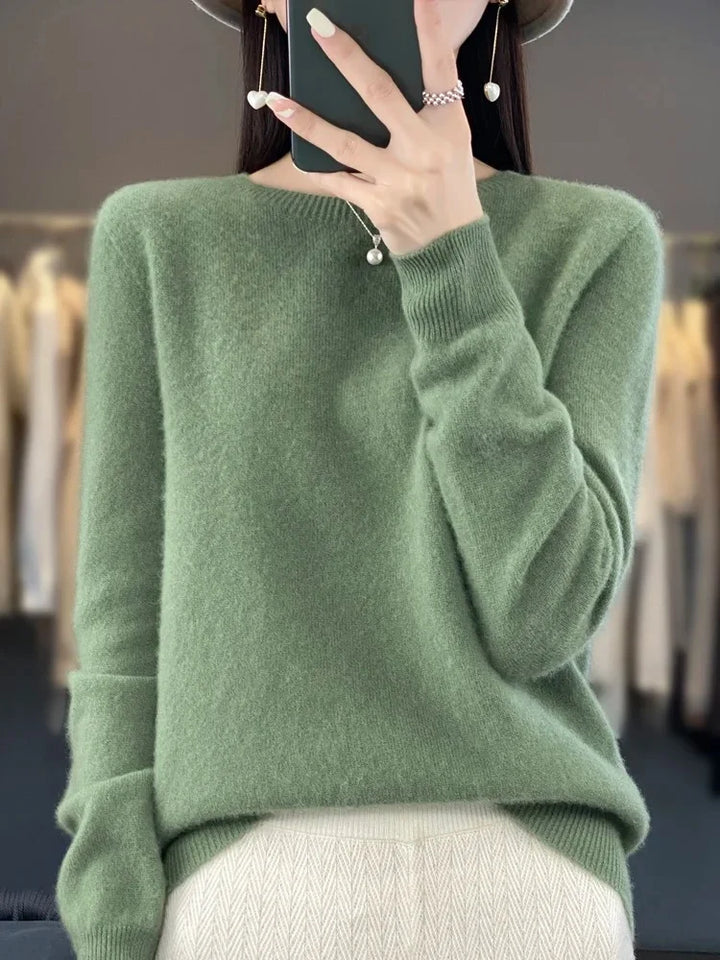 Women's crew neck jumper in beige shown from front angle on model