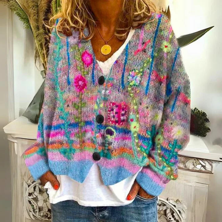 Women's floral knit cardigan with vibrant embroidered detailing and button-front closure, styled over white tee