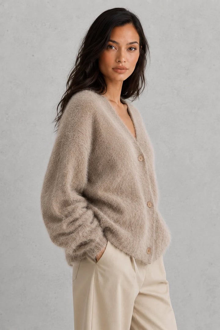 Side view of relaxed-fit cardigan with dropped shoulders and oversized sleeves