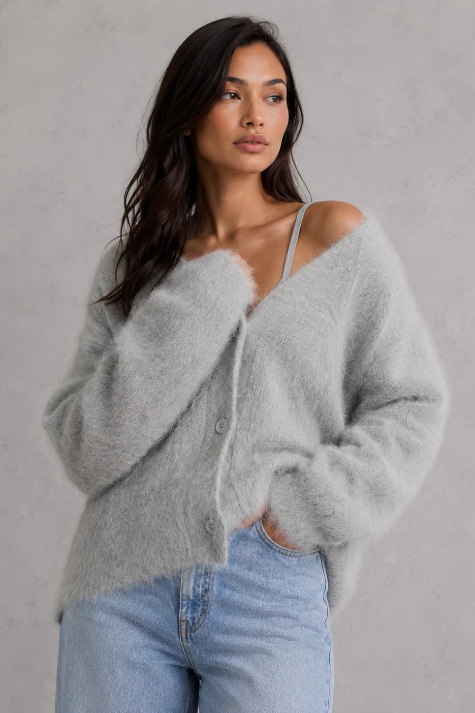 Back view of oversized cardigan showing relaxed drape and ribbed cuffs