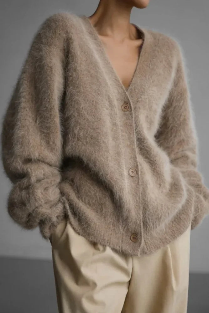 Full-length view of cardigan paired with tailored trousers for smart-casual outfit