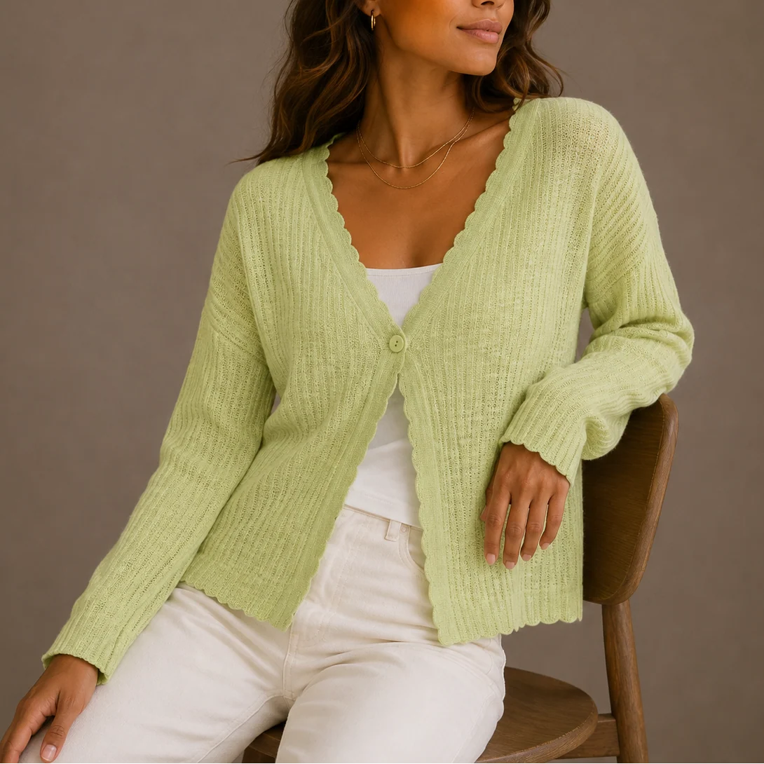 Side view showing relaxed fit and cropped length of women's knit cardigan with long sleeves