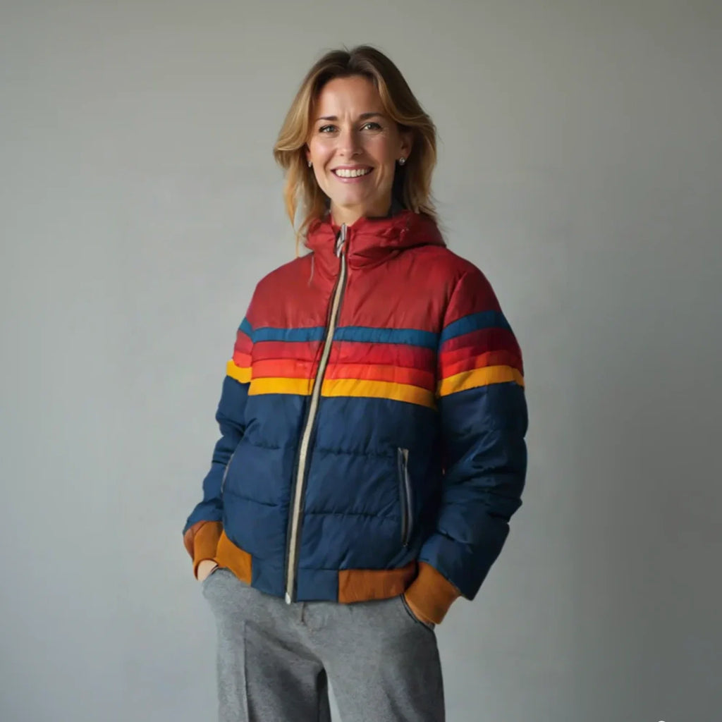 Woman wearing a women's quilted puffer jacket with bold stripe detailing and hooded neckline