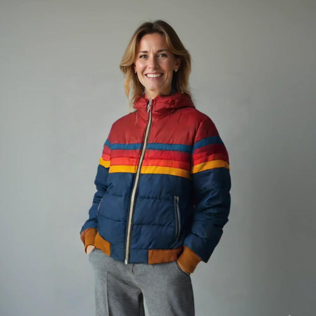 Woman wearing a women's quilted puffer jacket with bold stripe detailing and hooded neckline