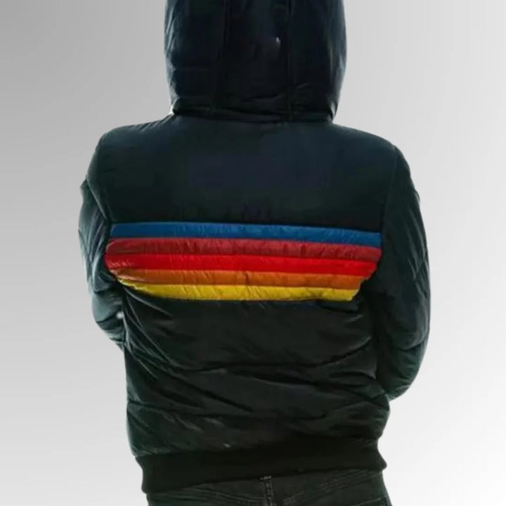 Full-length view of women's hooded puffer jacket paired with casual grey joggers
