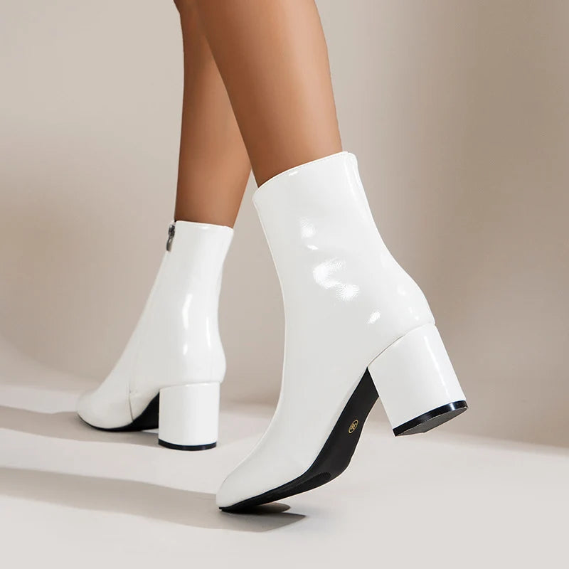 Rear view of women's block heel ankle boots in cream with side zip and chunky heel detail