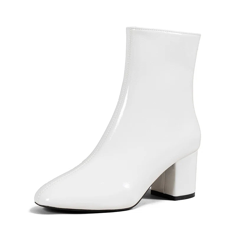 Women's ankle boots in cream with block heel demonstrating versatile styling for work or weekend