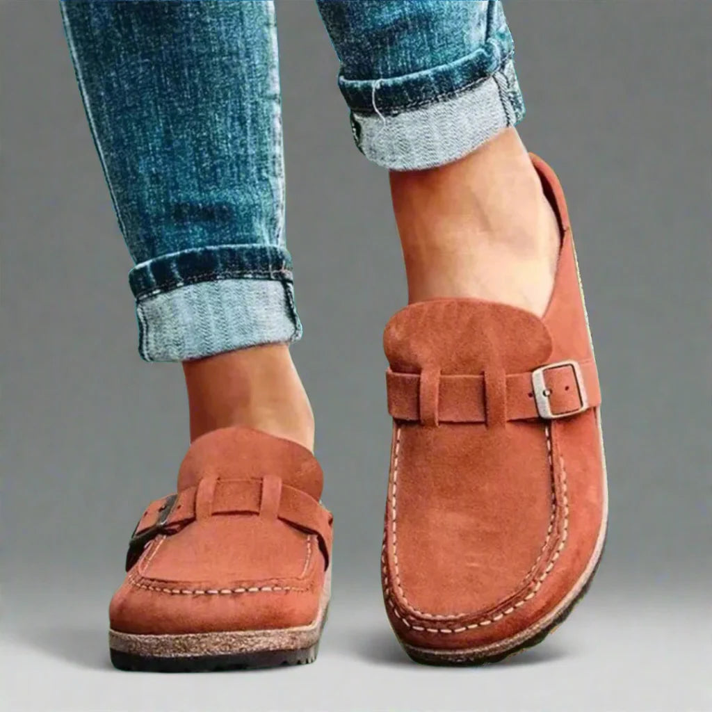 Women's buckle mules in terracotta suede-effect finish with adjustable strap and contrast stitching detail