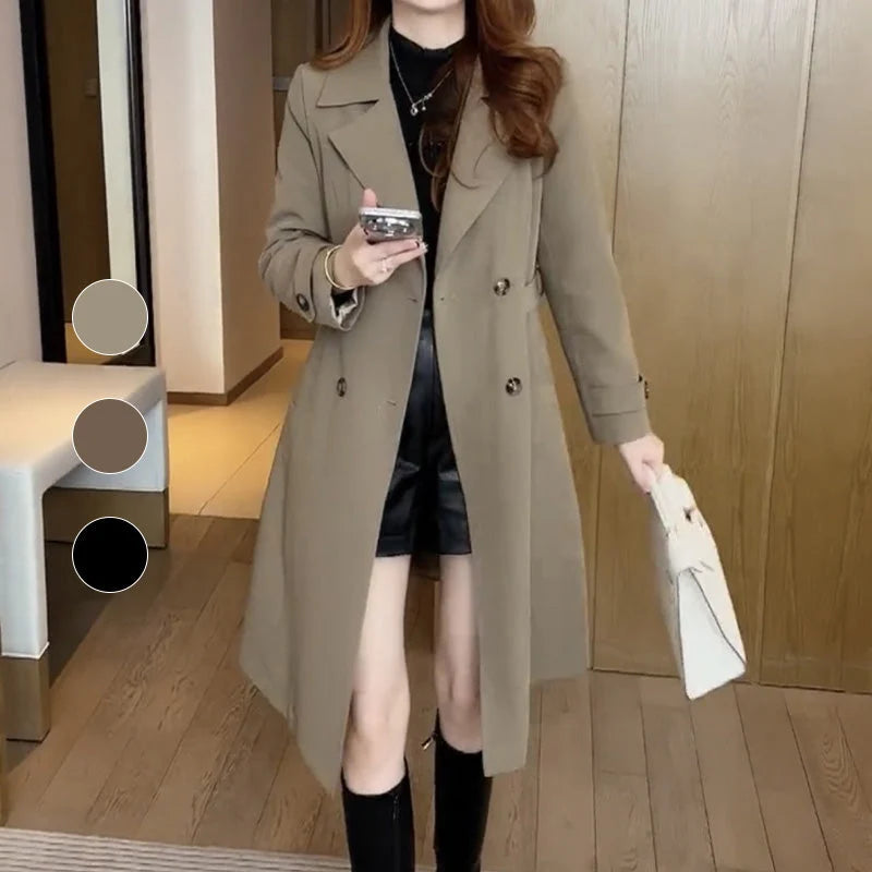 Women's trench coat styled with knee-high boots demonstrating versatile autumn layering piece