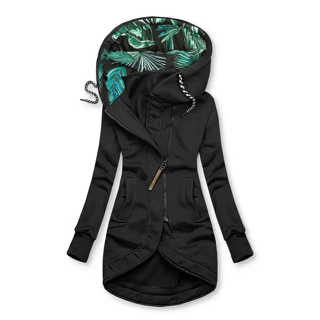 Close-up of hooded parka showing oversized hood with striped drawstring and tropical print interior