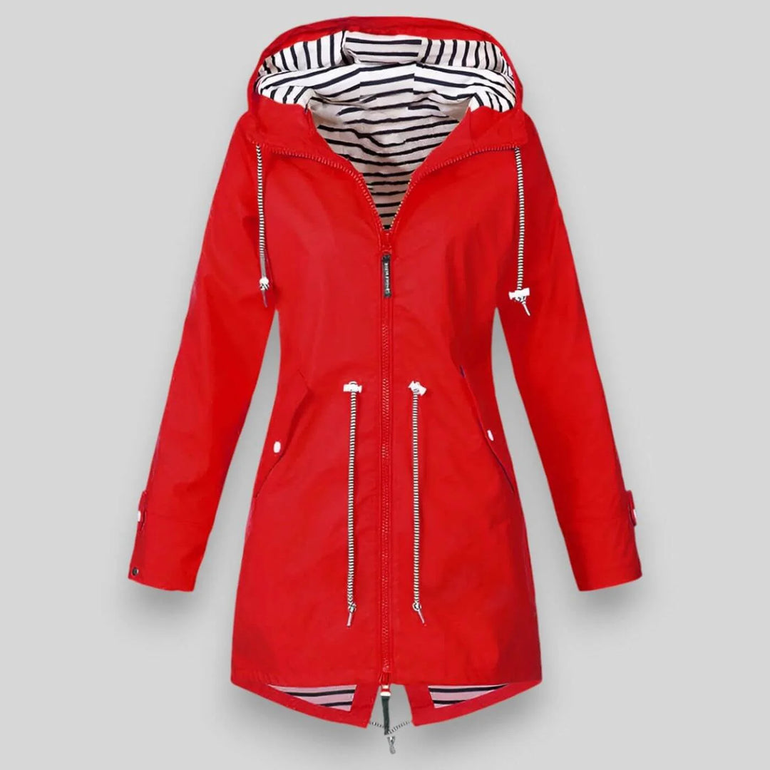 Mid-thigh length women's rain jacket with relaxed fit and nautical striped lining detail