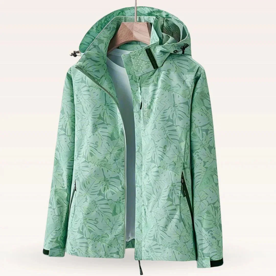 Close-up of tropical leaf print pattern on women's windbreaker jacket shell fabric