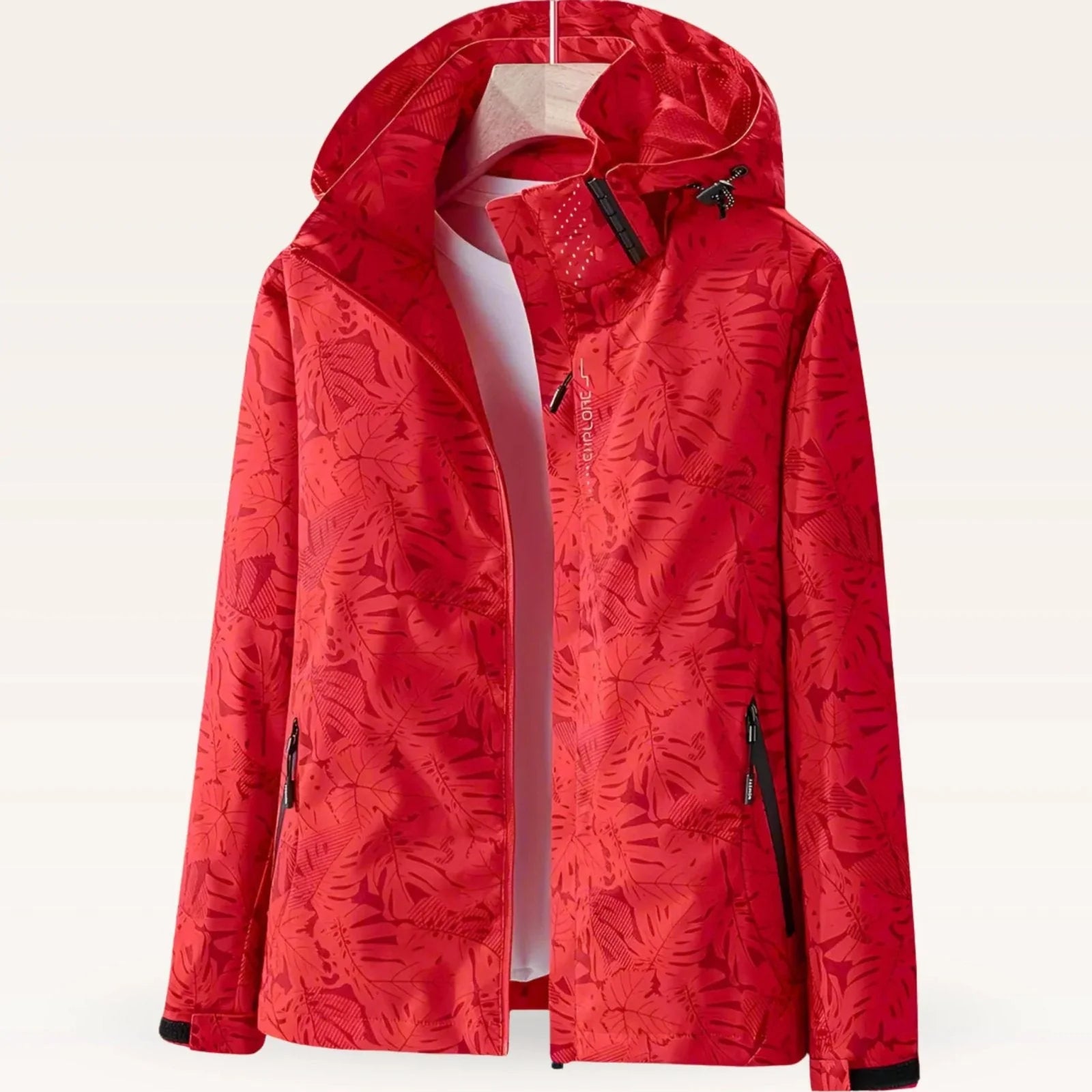 Detail of adjustable drawcord hood on women's tropical print windbreaker jacket