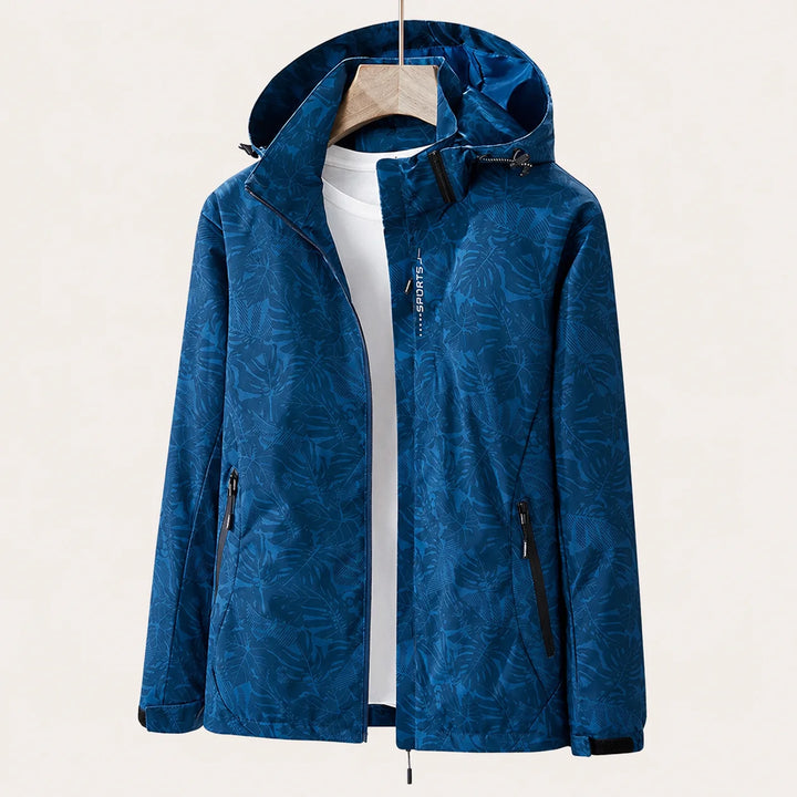 Women's hooded windbreaker jacket flat lay showing all-over leaf print design