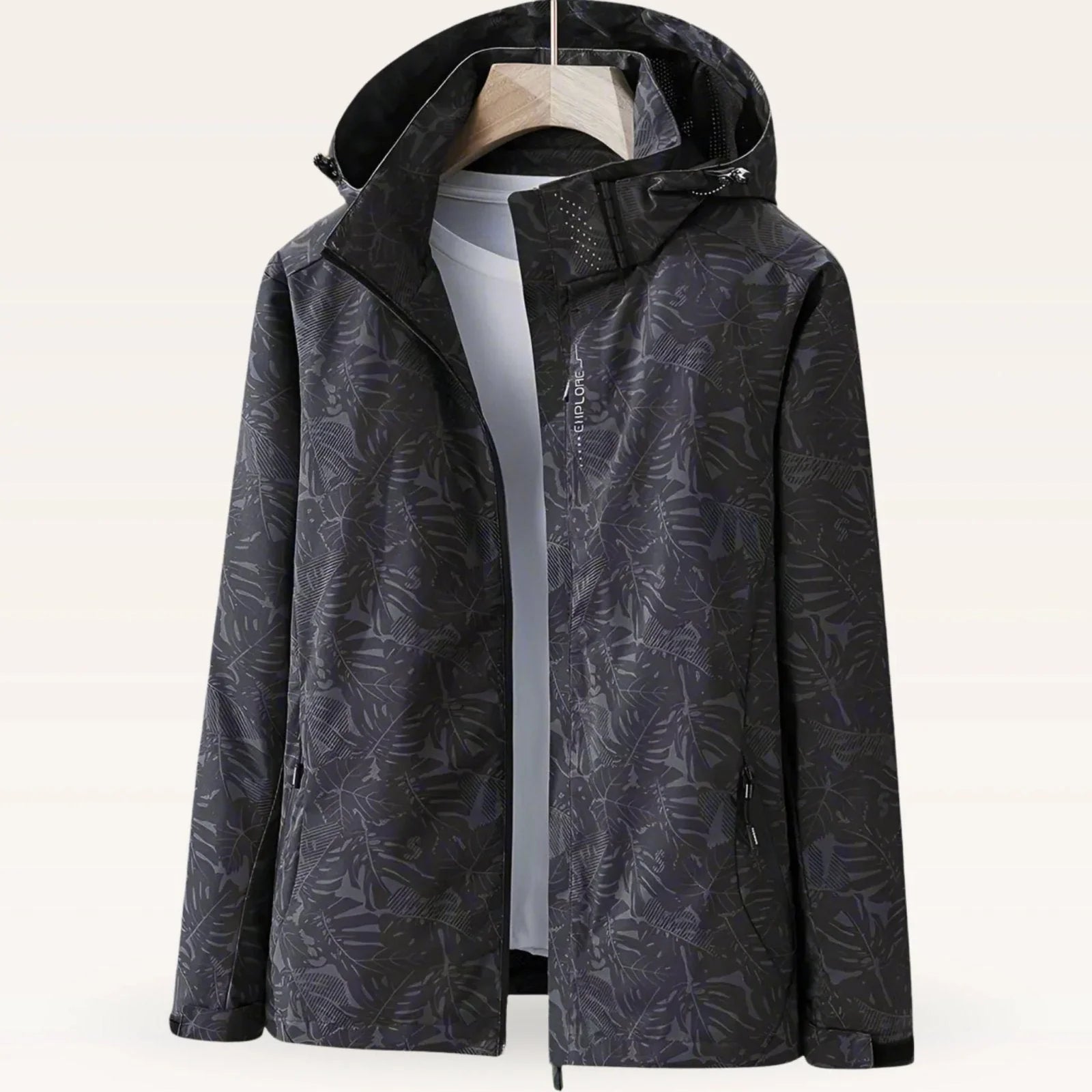 Back view of women's windbreaker jacket with tropical print and hood detail